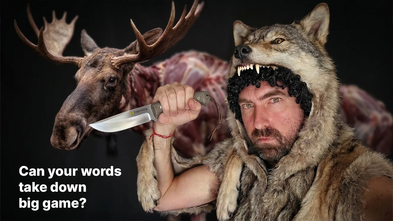 Jef wearing a wolf's pelt, its snarling head above his own and black sheep's wool curling out beneath it, gripping an HX Copywriting hunting knife in front of a butchered moose carcass. Text: Can your words take down big game?